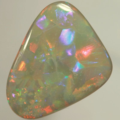 SOLID SEMI BLACK OPAL  Huge opal. Very bright fire, Flagstone Harlequin pattern. Top quality. SEE VIDEO